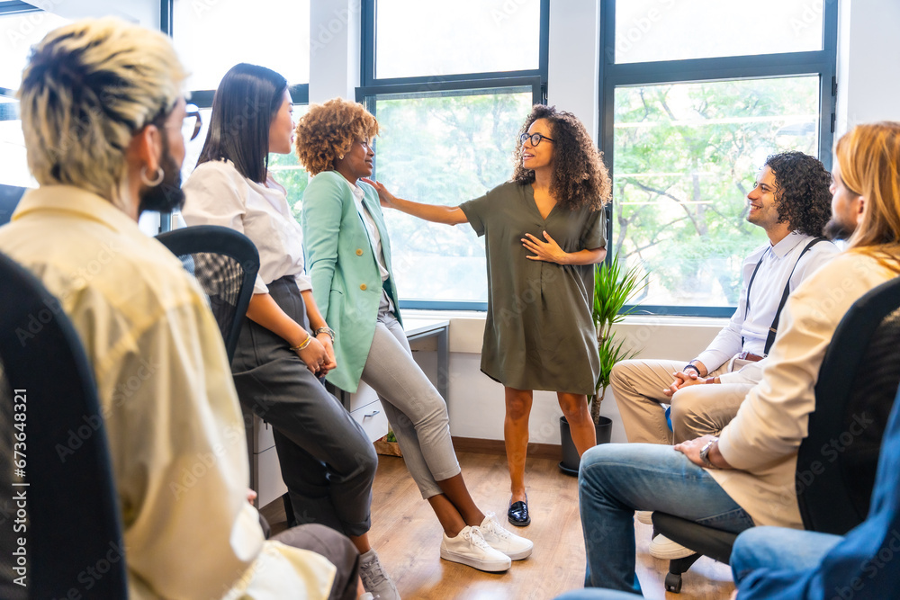 Woman advising a colleague in a coworking Woman advising a colleague in a coworking