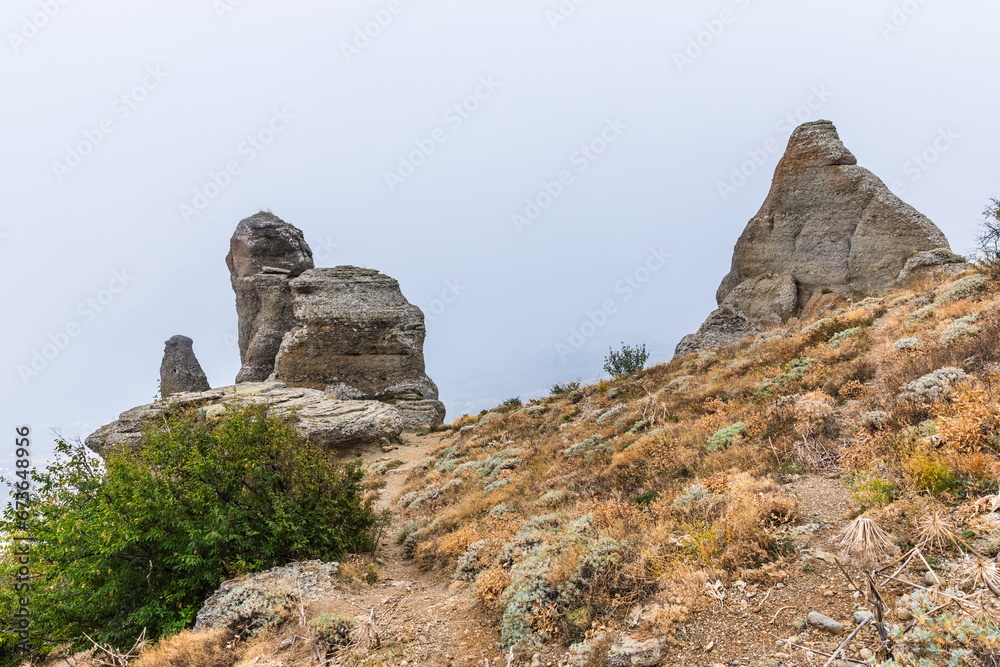 Mysterious mountain landscape of the Valley of Ghosts, a cluster of strangely shaped rocks on the western slope of Mount Demerdzhi in Crimea Mysterious mountain landscape of the Valley of Ghosts, a cluster of strangely shaped rocks on the western slope of Mount Demerdzhi in Crimea