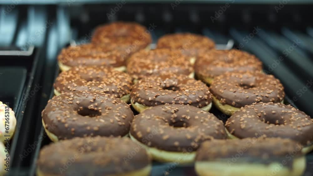 chocolate donuts in the supermarket. High quality FullHD footage chocolate donuts in the supermarket. High quality FullHD footage