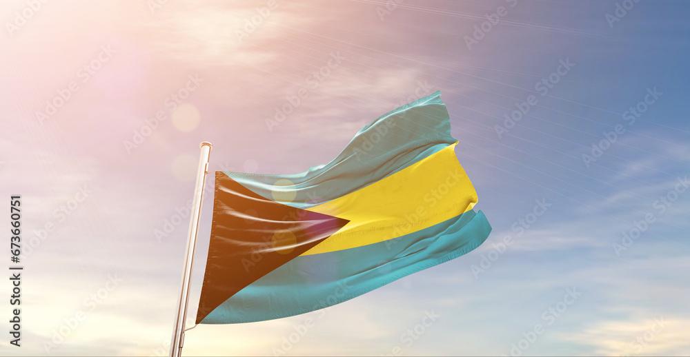 The Bahamas national flag waving in beautiful sky. The symbol of the state on wavy silk fabric.