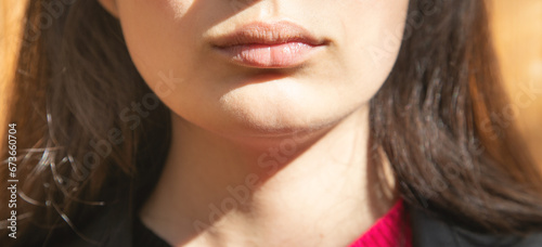 Closeup of mouth of young woman.
