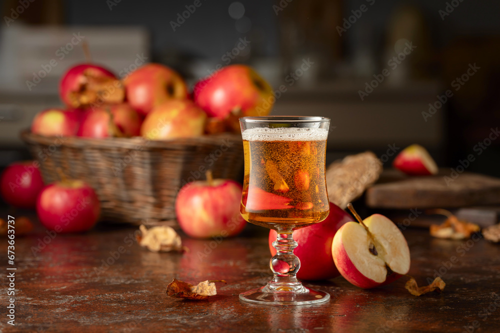Apple cider on an old kitchen table. Apple cider on an old kitchen table.