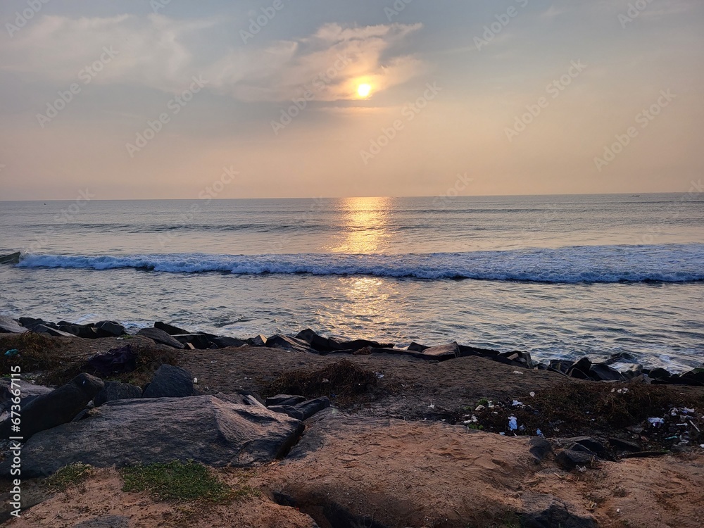 Puducherry, India - Oct 17 2023: Sun rise at Rock Beach in Pondicherry. Puducherry, India - Oct 17 2023: Sun rise at Rock Beach in Pondicherry.