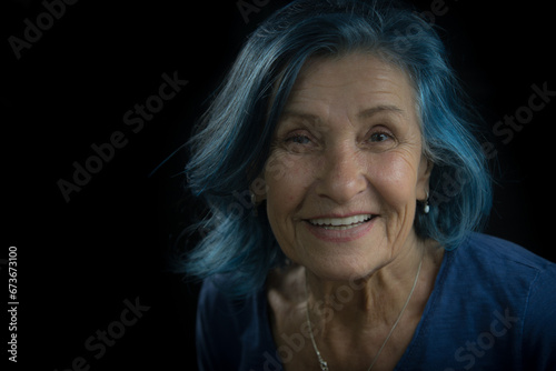 Modern Elderly Woman with Blue Eyes and Blue Hair Smiling