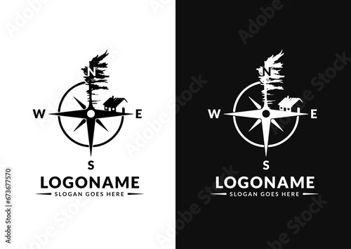 Foto Vector compass with windswept pine and house logo design