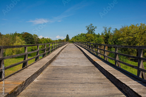 The Drveni Most wooden bridge over the Korana River in Karlovac, central Croatia © dragoncello
