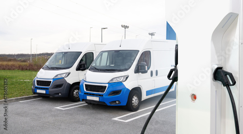 Fototapeta Naklejka Na Ścianę i Meble -  Electric delivery vans with electric vehicles charging station