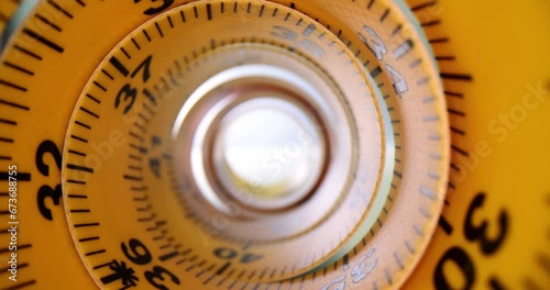 Bent tube tape measure on office table for necessary measurements. Designer roulette for measurements for garment construction concept