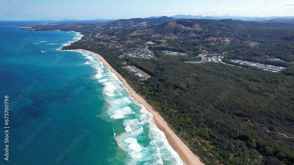 Turquoise Seascape With Lush Vegetation At Sapphire Beach In NSW, Australia - aerial shot Turquoise Seascape With Lush Vegetation At Sapphire Beach In NSW, Australia - aerial shot