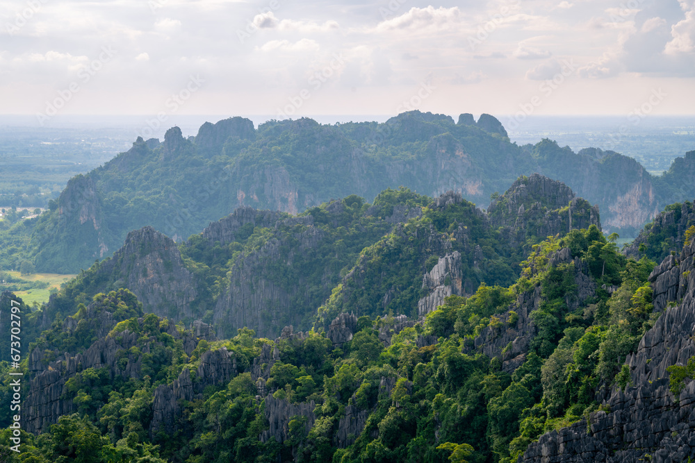 Fototapeta premium A viewpoint in top of limestone mountains over the city in Phitsanulok province, Thailand