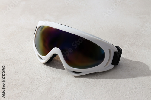 White ski goggles on a light background