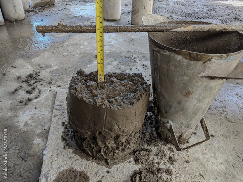 slump test on fresh concrete, 12+-2 cm.  Slump test for construction concrete
