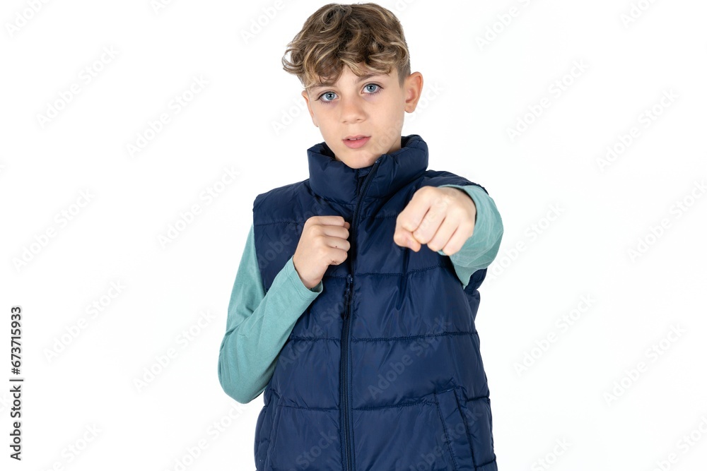 Caucasian teen boy Punching fist to fight, aggressive and angry attack, threat and violence Caucasian teen boy Punching fist to fight, aggressive and angry attack, threat and violence