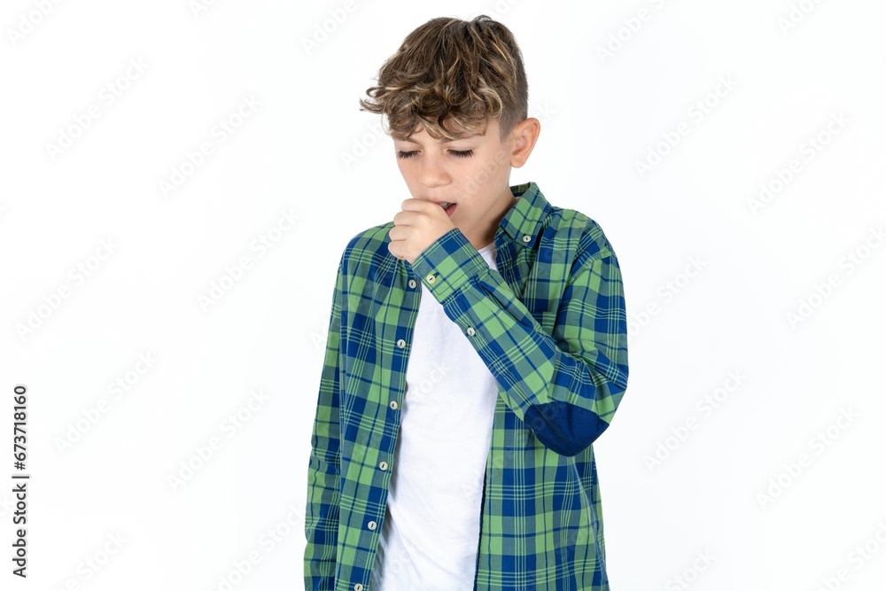 Caucasian teen boy feeling unwell and coughing as symptom for cold or bronchitis. Healthcare concept. Caucasian teen boy feeling unwell and coughing as symptom for cold or bronchitis. Healthcare concept.