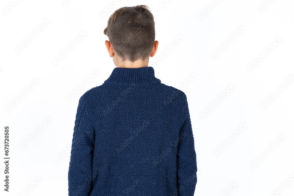 The back view of a Caucasian teen boy. Studio Shoot. The back view of a Caucasian teen boy. Studio Shoot.