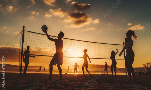 Silhouette of people playin beach volley at sunset