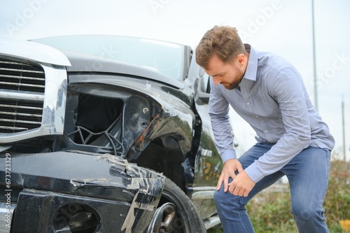 Car accident. Man after car accident. Man regrets damage caused during car wreck