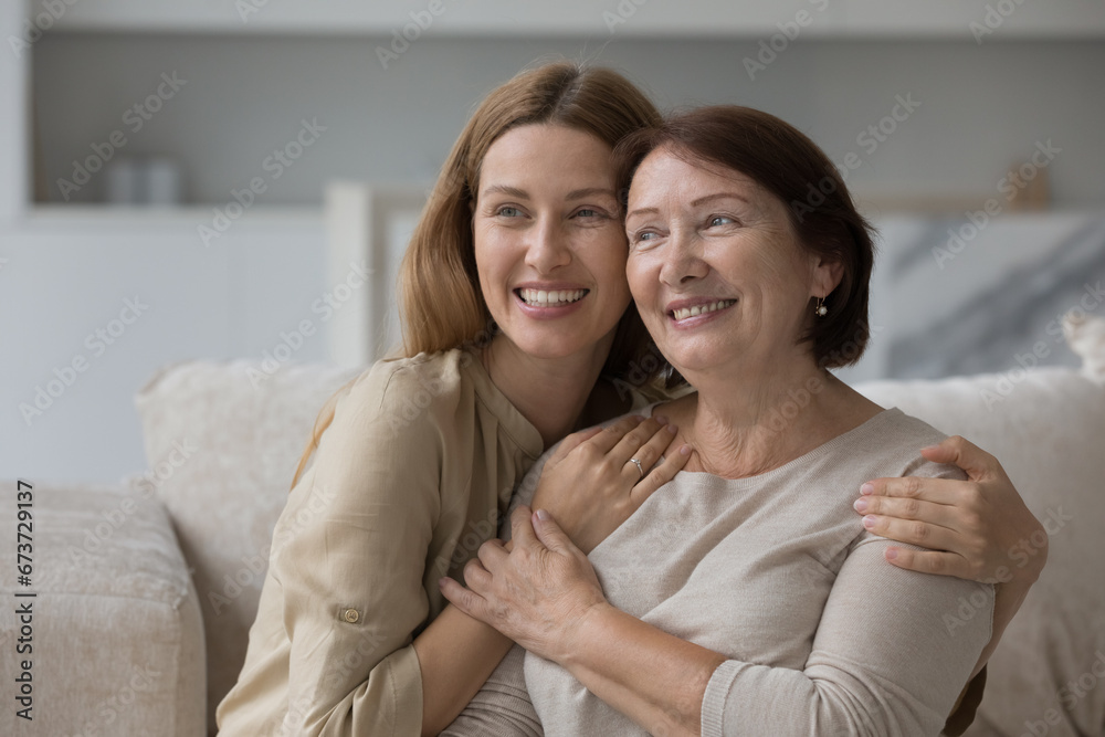 Happy senior mother and adult kid looking at camera, smiling, laughing, posing together, hugging with head touches, celebrating mothers day, enjoying affection, closeness, relation - obrazy, fototapety, plakaty 