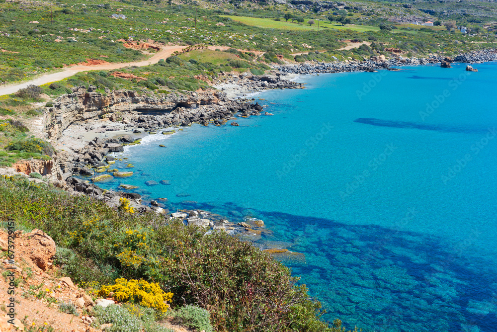 Obraz premium Beautiful beach and water bay in the greek spectacular coast of Peloponnese. Turquoise blue transparent water, unique rocky cliffs, Greece summer top travel destination