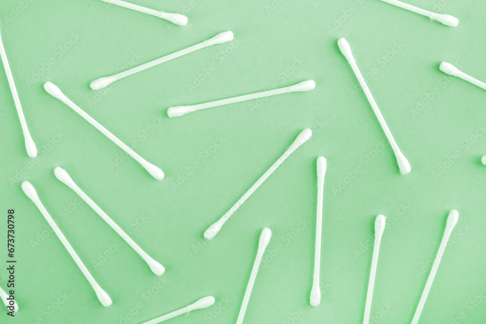 Pattern of white plastic cotton swabs or sticks top view