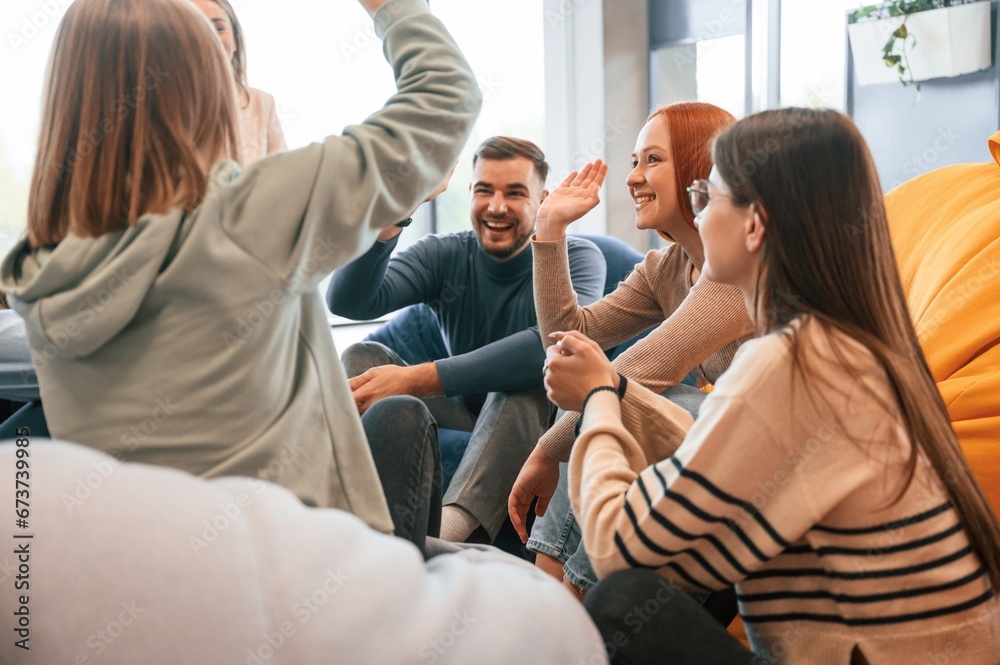 Talking, helping each other. Group of people are having therapy meeting together Talking, helping each other. Group of people are having therapy meeting together