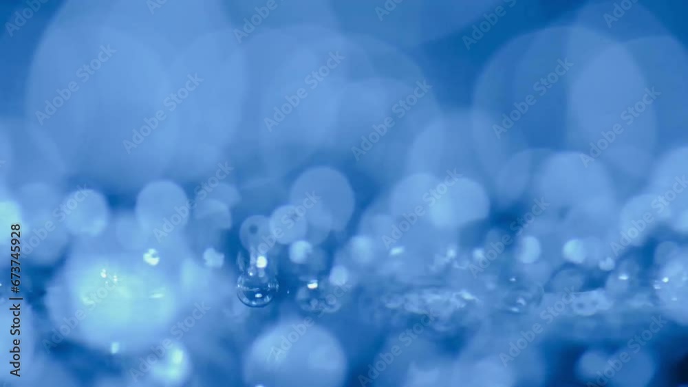 Close-up water bubbling or boiling in clear glass. on a black background.soft focus slow motion. Close-up water bubbling or boiling in clear glass. on a black background.soft focus slow motion.