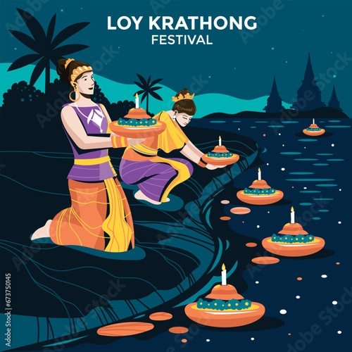 Two thai woman holding a krathong sitting on a raft by the river at Loy krathong festival
