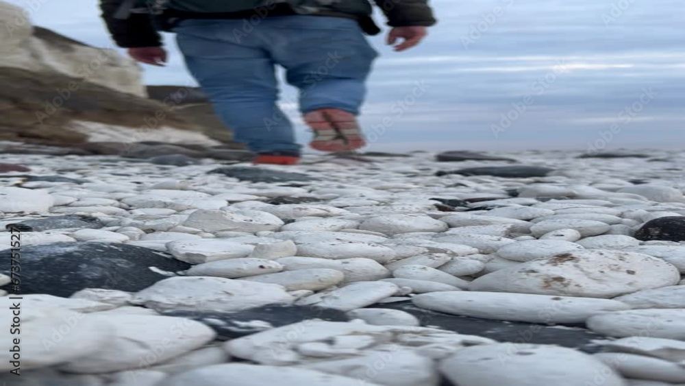 Chalk rubble, man walking along the shore of the cliff, Moens Klint, Moen Island, Denmark, Europe Chalk rubble, man walking along the shore of the cliff, Moens Klint, Moen Island, Denmark, Europe