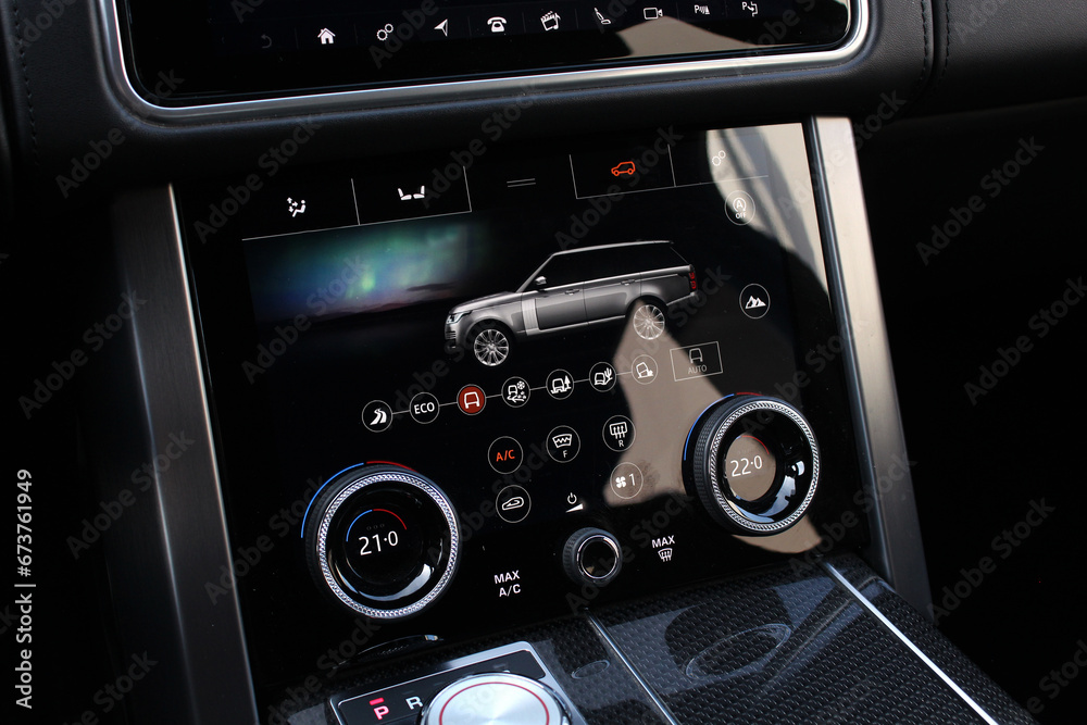 Close-up detail with the air conditioning panel inside a Lux car. Air conditioning panel. Touch panel climate control of an lux SUV. Premium car dashboard in interior. Modern luxury car interior.