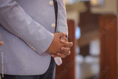 male hands clasped, as in church praying to lord © jayanthi photography