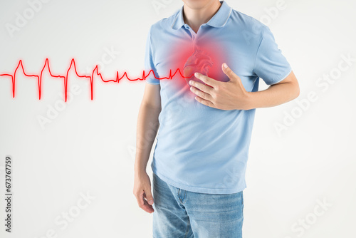 Heart attack, man with chest pain suffers from heartache, myocardial infarction, cardiogram and heartbeat photo