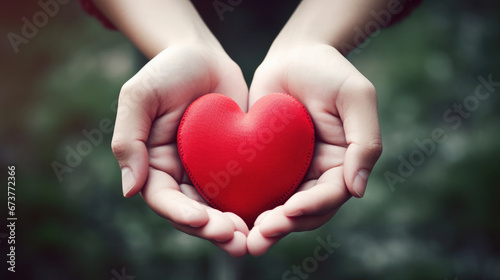 hand holding red heart  health care  love  organ donation  mindfulness  wellbeing  family insurance and CSR concept  world heart day  world health day  world mental health day  praying concept