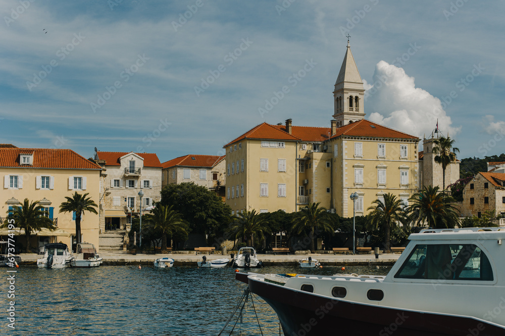 Amazing view of yacht marina and old town Supetar, Brah island, Croatia. Beautiful sunny day.