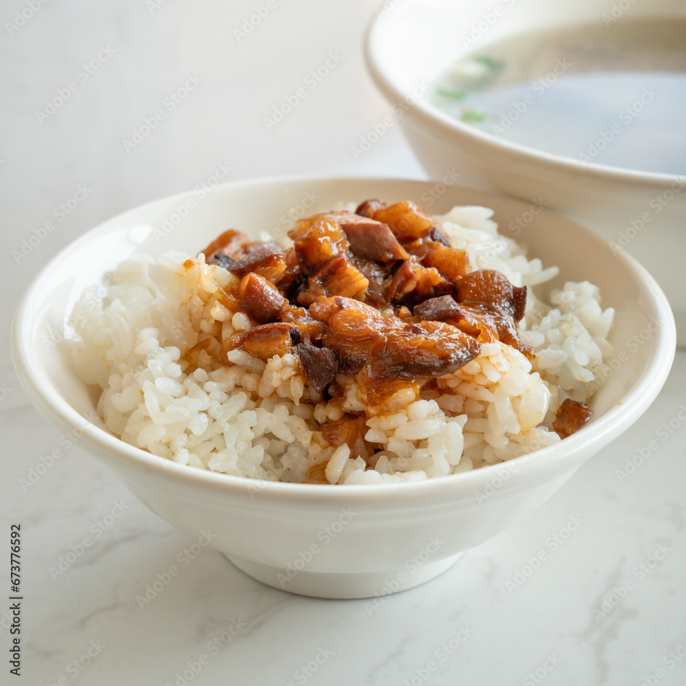 Braised meat over cooked rice, famous and delicious street food in Taiwanese restaurant. Braised meat over cooked rice, famous and delicious street food in Taiwanese restaurant.