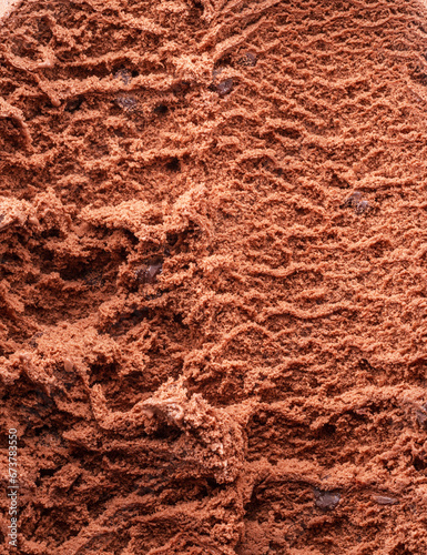 Structure of frozen chocolate ice cream close up. Ice cream background.