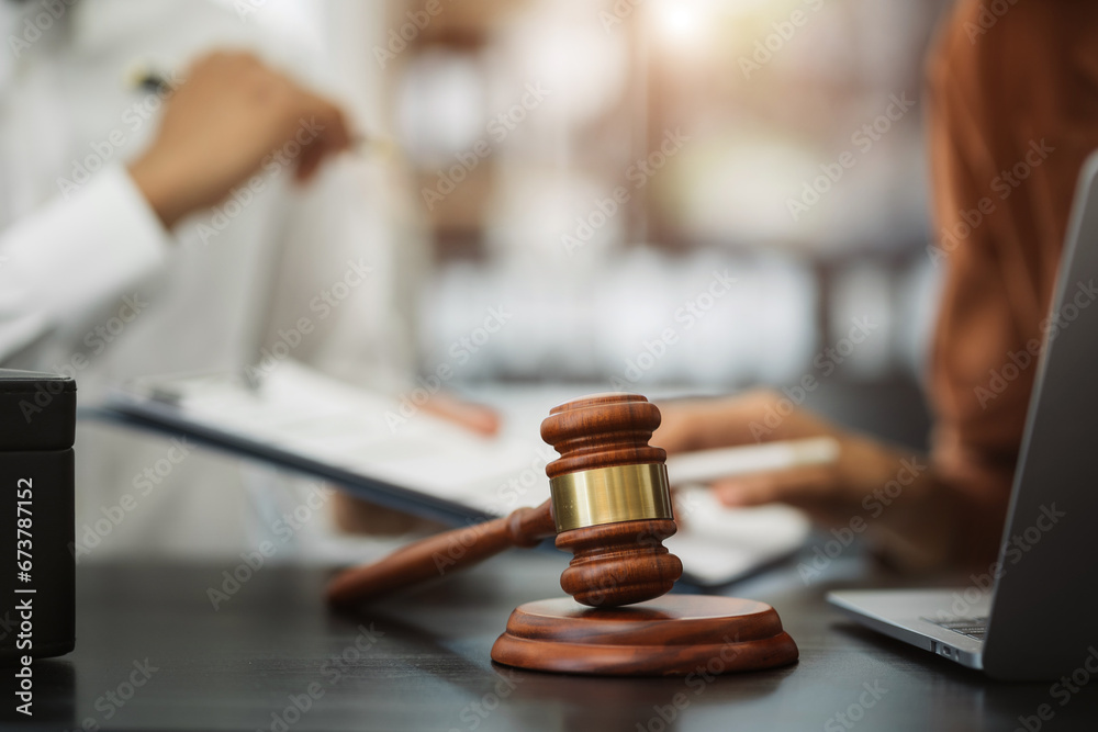Teamwork of business lawyer meeting working hard about legal legislation in courtroom to help their customer. Teamwork of business lawyer meeting working hard about legal legislation in courtroom to help their customer.