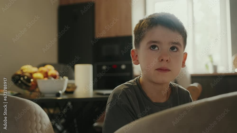 Adorable child looking directly into the camera while telling a story from school. Facial expressions. Closeup view. Adorable child looking directly into the camera while telling a story from school. Facial expressions. Closeup view.