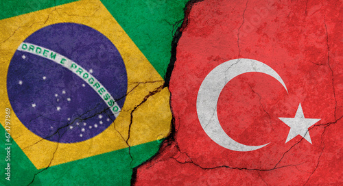 Brazil and Turkey flags, concrete wall texture with cracks, grunge background, military conflict concept