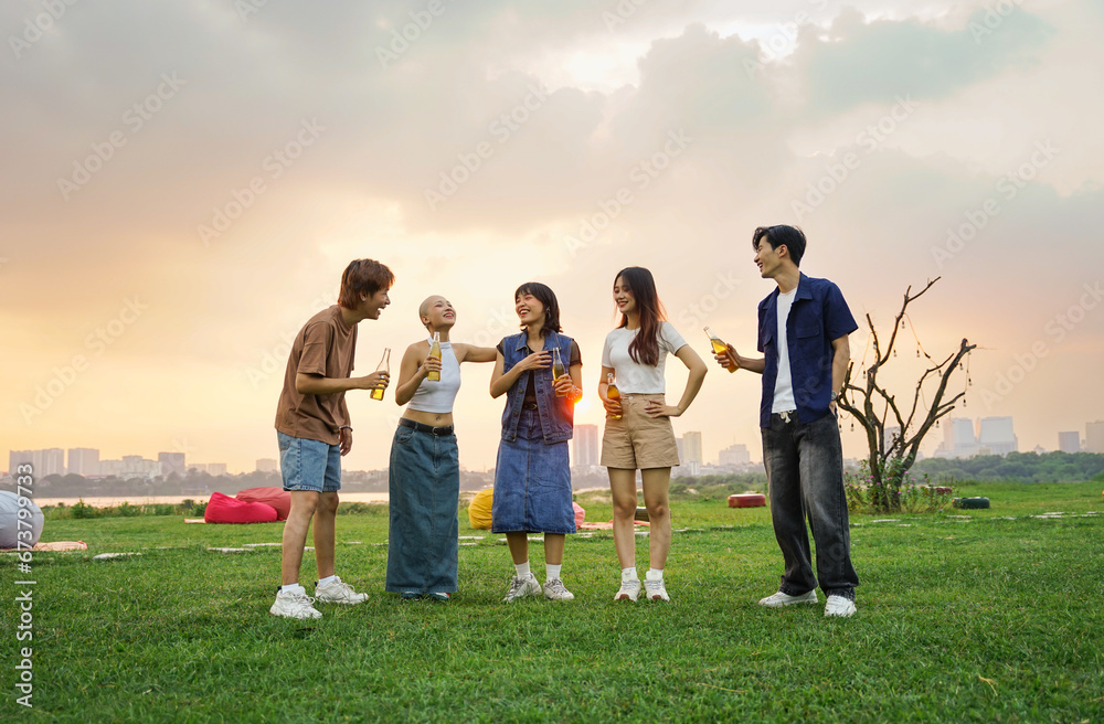 Image of group of friends celebrating and drinking beer together Image of group of friends celebrating and drinking beer together