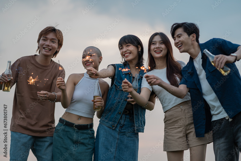 Image of group of friends celebrating and drinking beer together Image of group of friends celebrating and drinking beer together