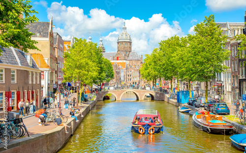 Amsterdam city centre and water canal in De Wallen district, Netherlands photo