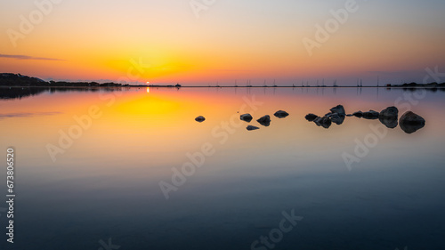A rising sun over the lagoon Stagno di Notteri on Sardinia island. photo