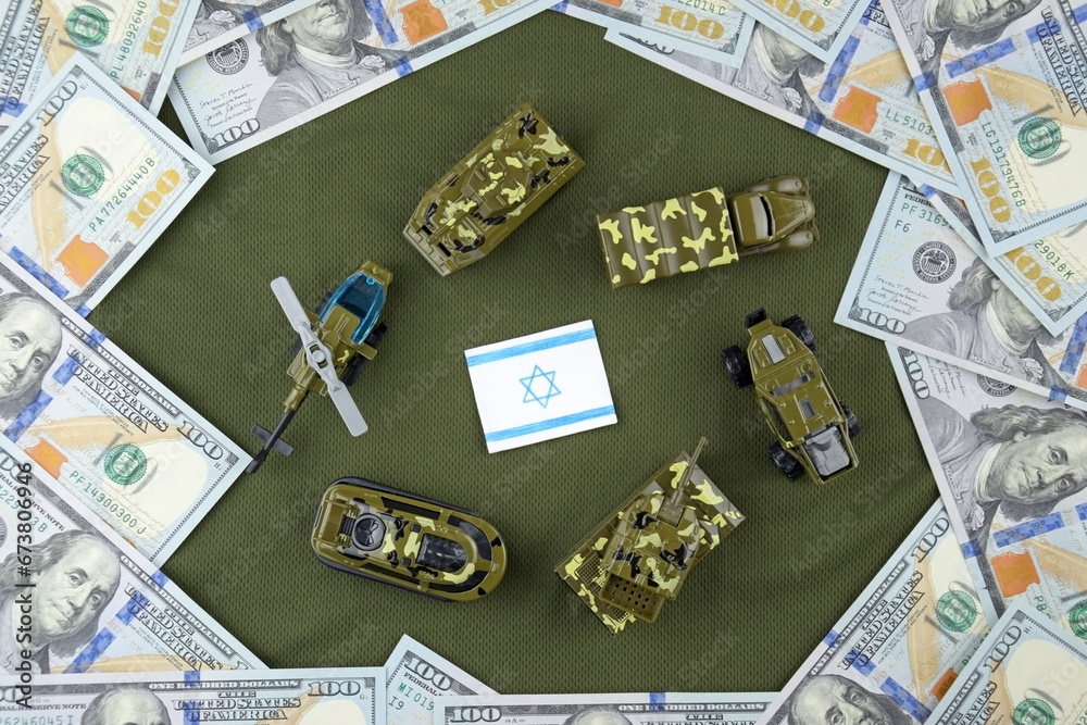 A battle tank with the Israeli flag on a background of US dollar banknotes.
