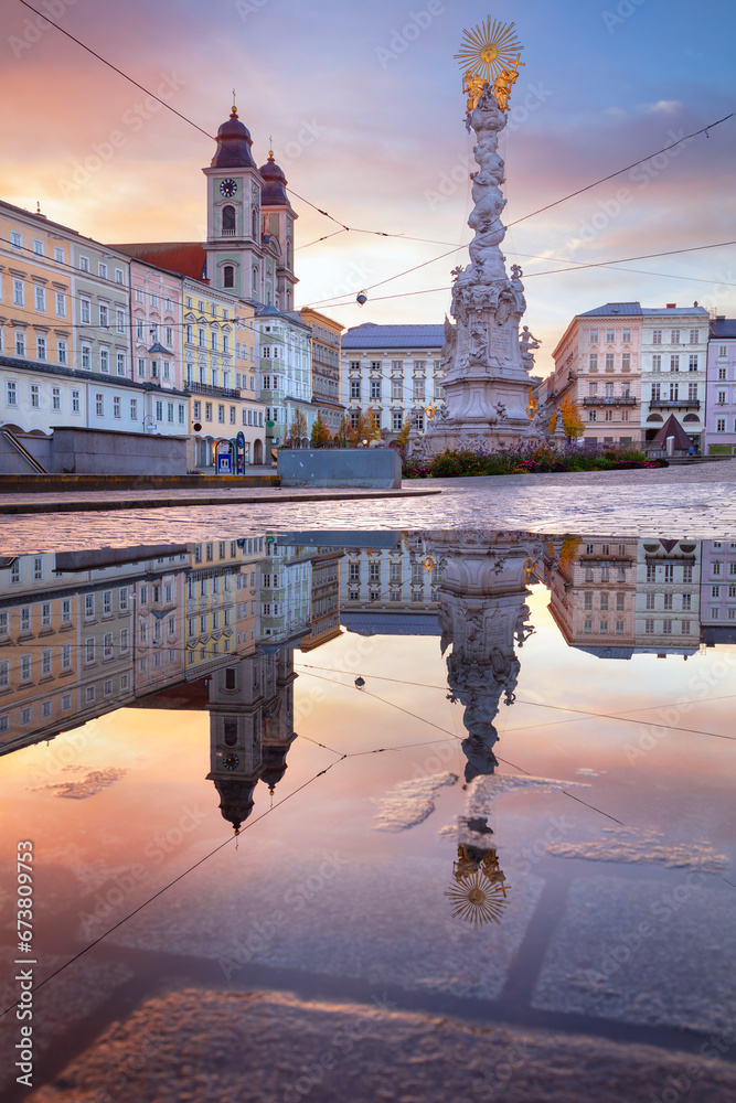 Linz, Austria. Cityscape image of main square of Linz, Austria with reflection of the city skyline at beautiful sunrise.