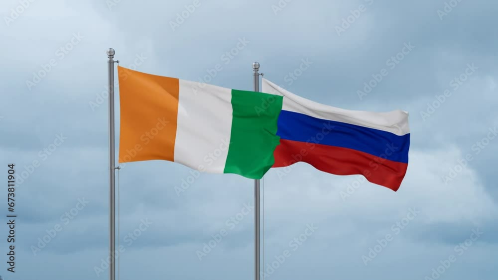 Russian Federation and Ivory Coast, Cote d'Ivoire flag waving together on cloudy sky, endless seamless loop Russian Federation and Ivory Coast, Cote d'Ivoire flag waving together on cloudy sky, endless seamless loop