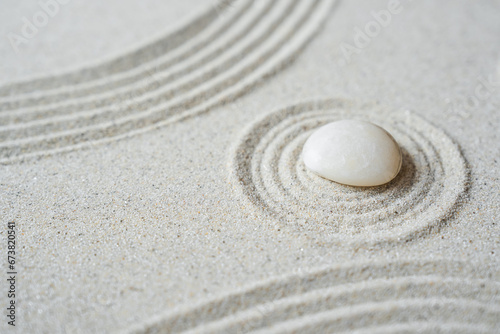 Canvas Print White zen stone on sand round ripple