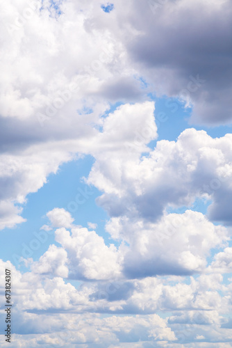Beautiful blue sky with many white fluffy light cloud in sunlight background, texture