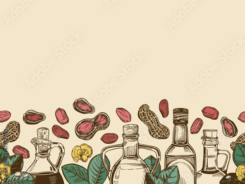 Composition with oil bottles and a sprig of peanuts with leaves and a flower, peanut nuts.