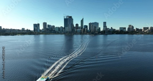 Perth CBD from South perth with boat passing through 