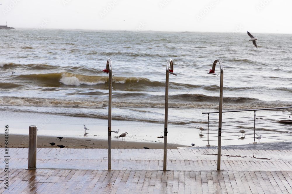storm surge seen from behind the showers arranged on the bathhouse during the flood that occurred in Salerno storm surge seen from behind the showers arranged on the bathhouse during the flood that occurred in Salerno